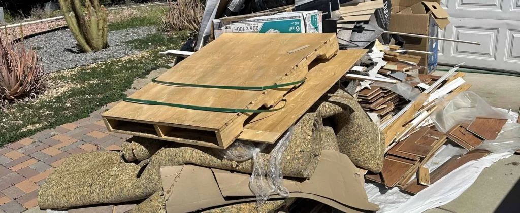 Pile of broken concrete and debris on driveway for junk hauling