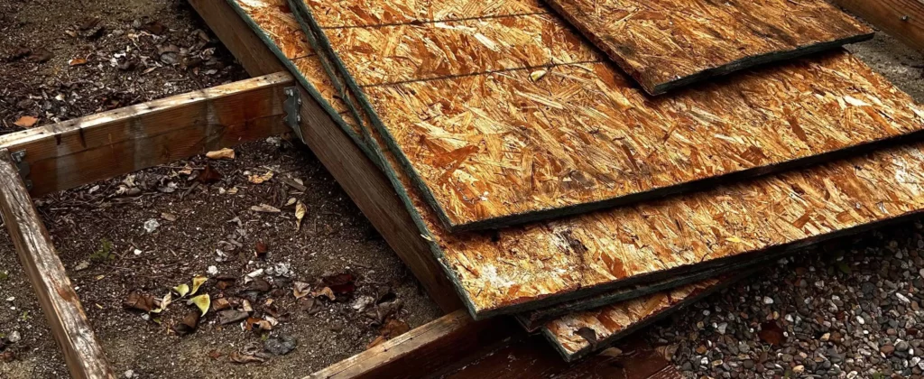 Scrap plywood and lumber stacked for junk hauling service